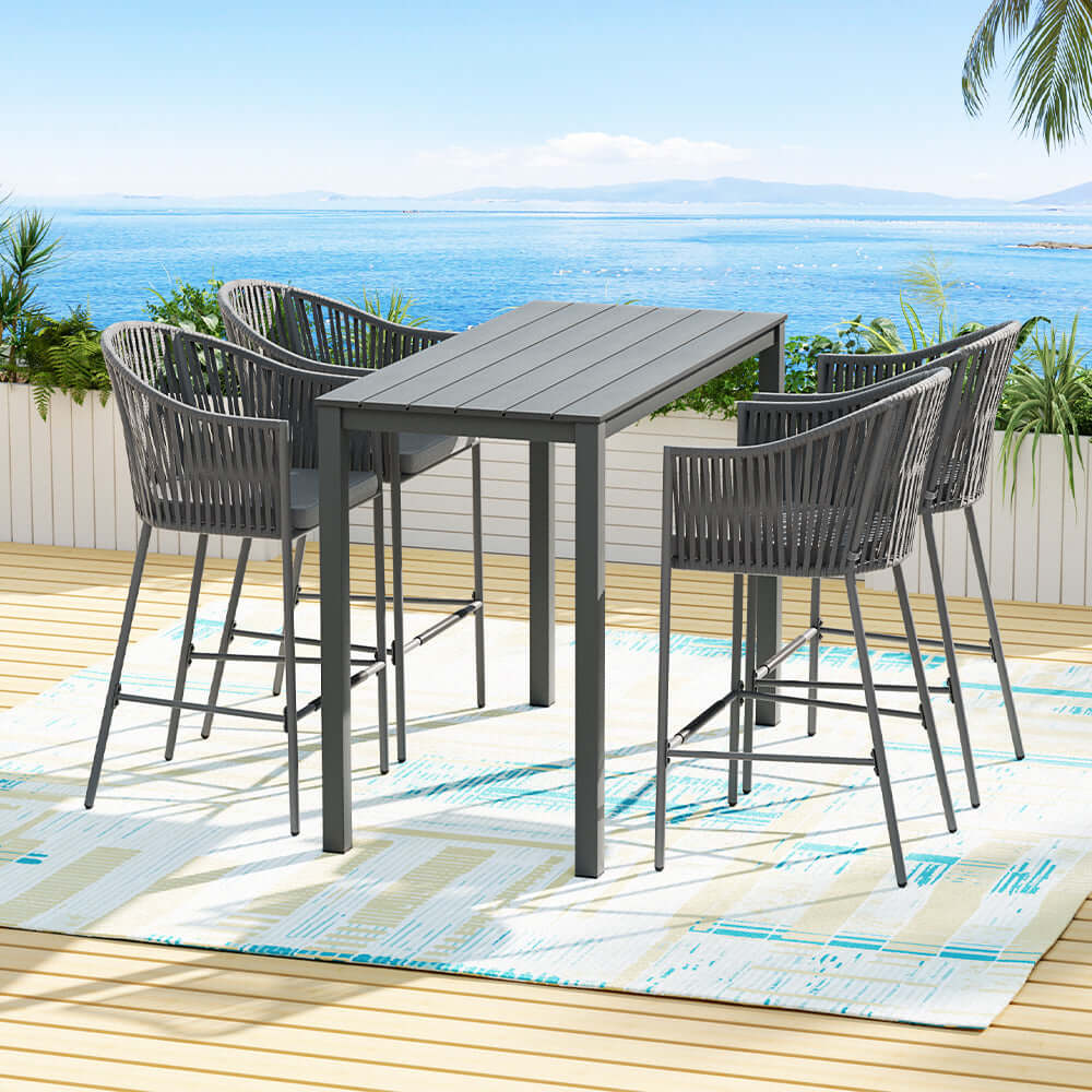 Gardeon 5-piece outdoor bar set with rope chairs and table on patio with ocean view, perfect for affordable luxury.