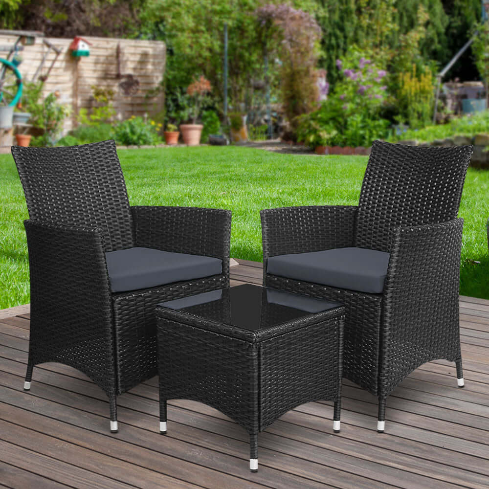 Gardeon 3PC outdoor wicker bistro set with black cushions on a patio, ideal for affordable and quality outdoor lounging.