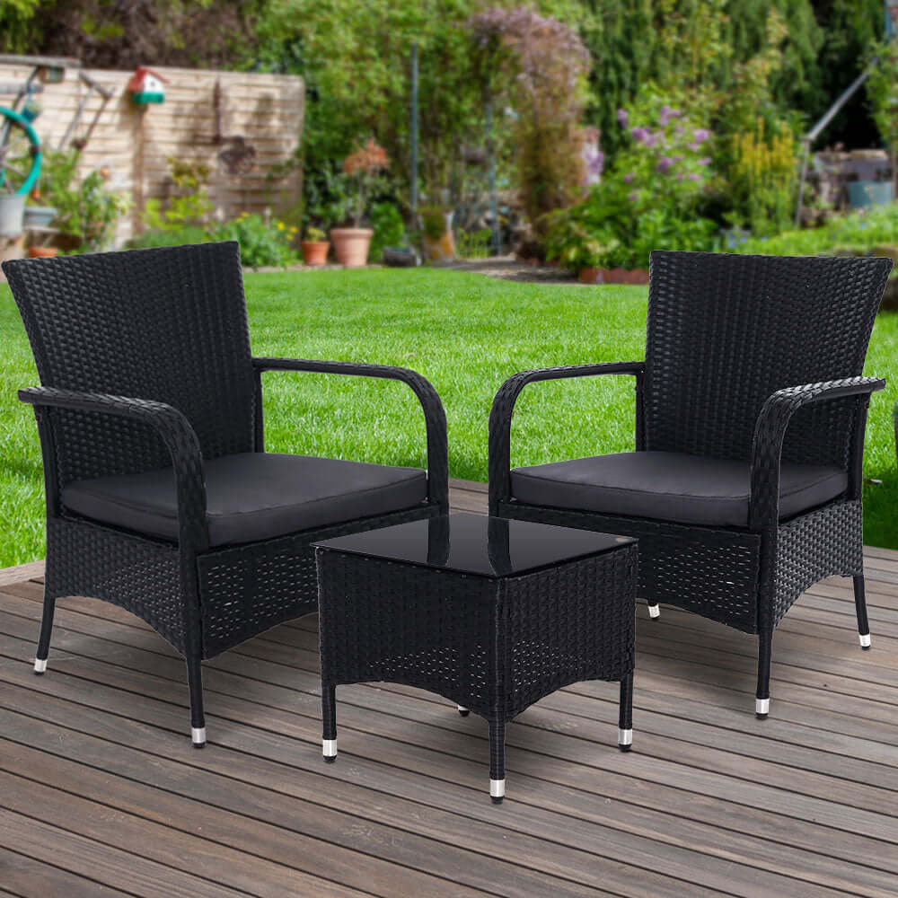 Gardeon 3PC outdoor bistro set with wicker chairs and table in a garden setting, offering affordable quality and stylish design.