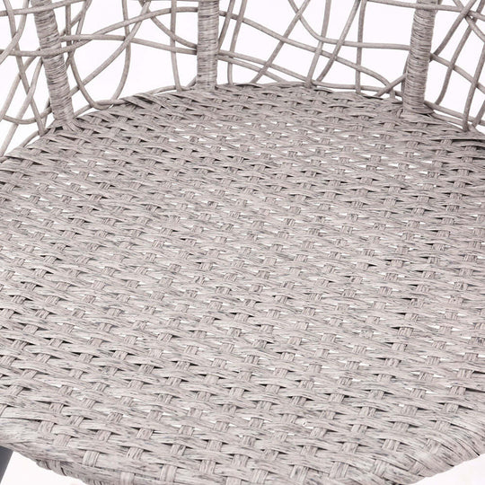 Close-up of grey rattan chair seat showcasing the intricate weaving and quality craftsmanship for outdoor furniture.