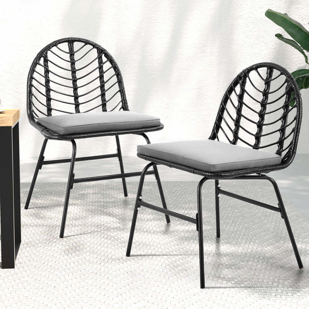 Gardeon black outdoor dining chairs with wicker design and grey cushions, ideal for stylish patio decor.