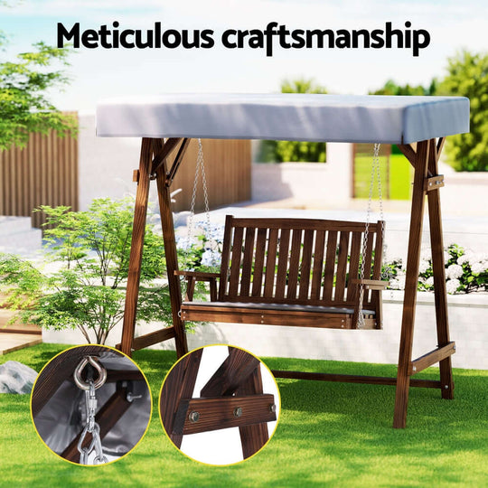 Gardeon outdoor wooden swing chair with canopy in garden, showcasing meticulous craftsmanship and durable design.