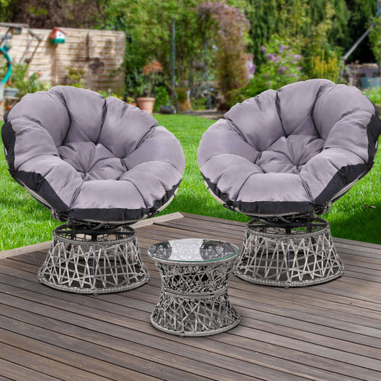 Gardeon outdoor lounge set with grey wicker Papasan chairs and glass side table on a patio.