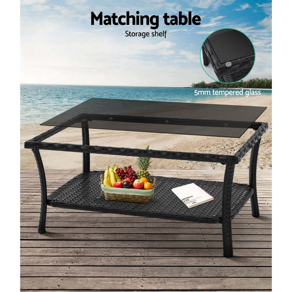 Gardeon matching outdoor coffee table with tempered glass top and storage shelf, stylish wicker design by the beach.