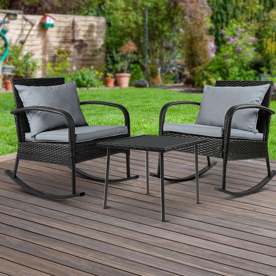 Gardeon 3PC black outdoor rocking chair set with cushioned seats and glass table, perfect for patio and bistro use.