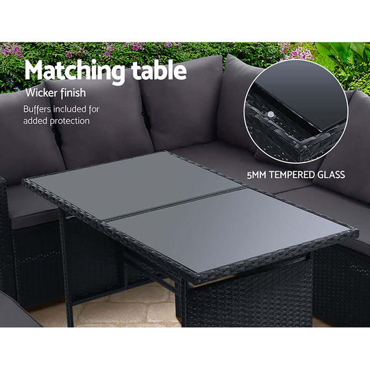 Gardeon outdoor wicker dining table with 5mm tempered glass top and protective buffers, matching the sofa set.