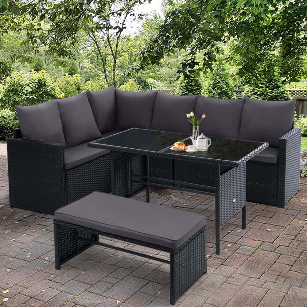 Gardeon outdoor 8-seater wicker sofa dining set in black, perfect for garden parties or relaxation.