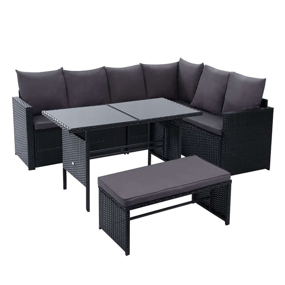 Gardeon affordable 9-seater outdoor sofa dining set with black cover, perfect for relaxing or entertaining guests.