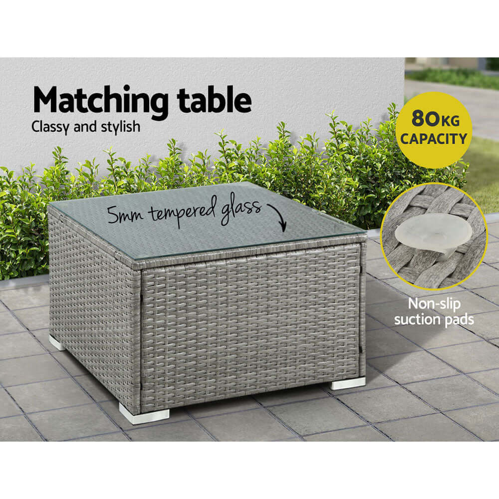 Stylish outdoor matching table with 5mm tempered glass, non-slip suction pads, 80kg capacity, perfect for lounging.