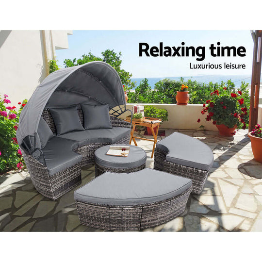 Gardeon sun lounge setting featuring a grey wicker lounger day bed on a patio, perfect for affordable outdoor relaxation.