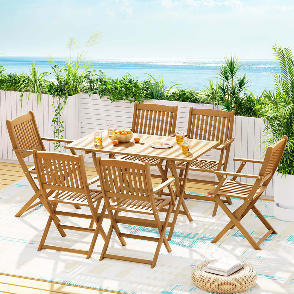 Gardeon 7 Piece Outdoor Dining Set with foldable wooden table and chairs in a sunny setting.