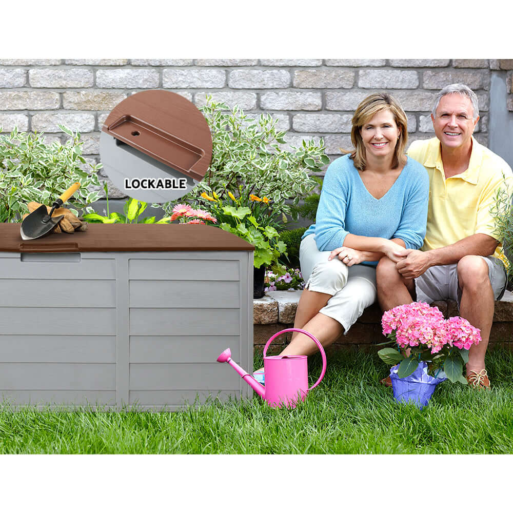 Couple relaxing near Gardeon 290L Lockable Outdoor Storage Box, ideal for affordable DIY garden organization.