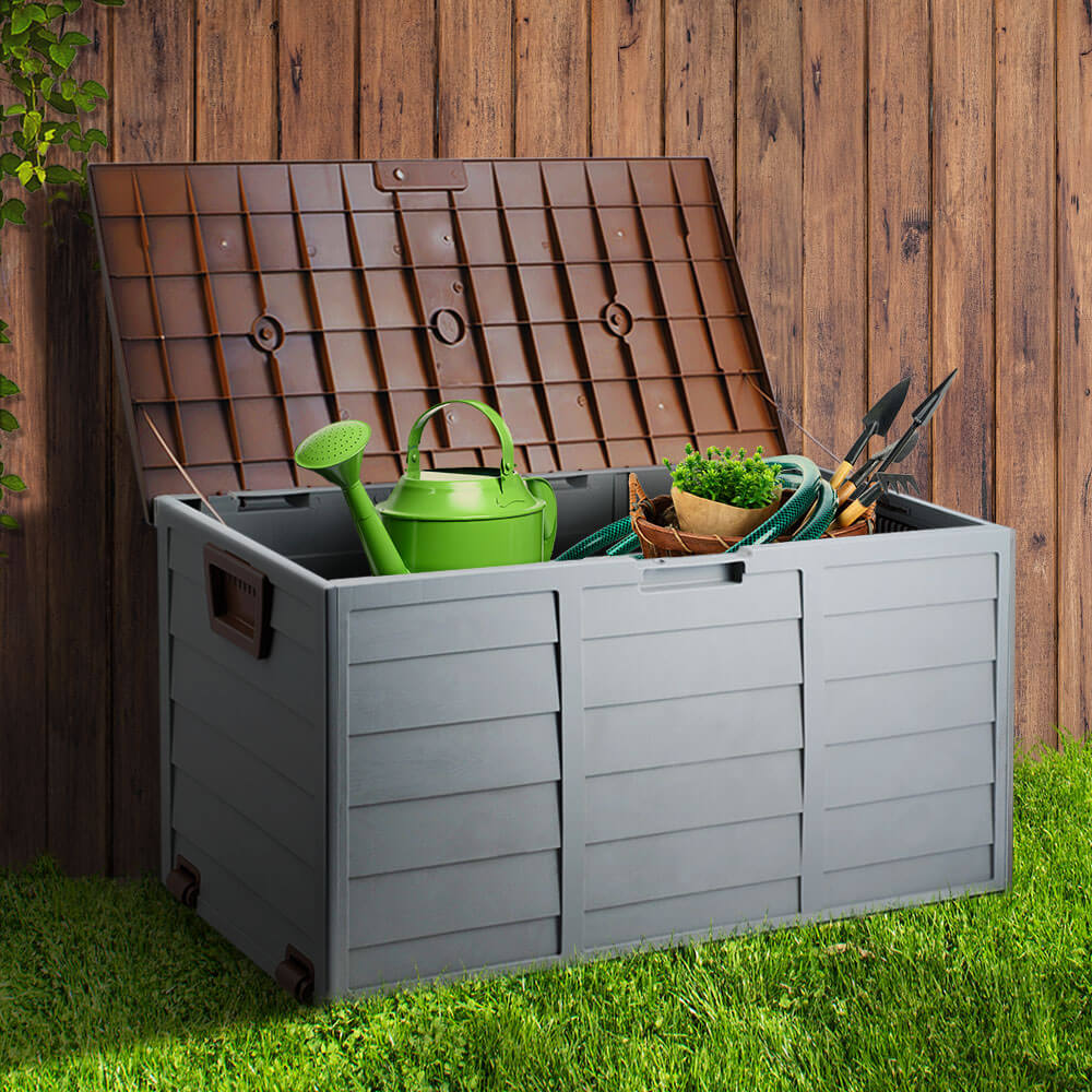 Gardeon 290L Outdoor Storage Box in grey with gardening tools, perfect for DIY and organized outdoor spaces.