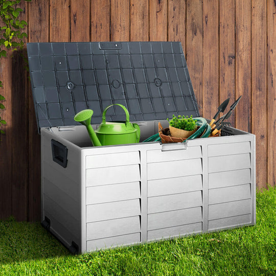 Gardeon 290L outdoor storage box in grey, featuring garden tools and watering can, perfect for organizing outdoor items.