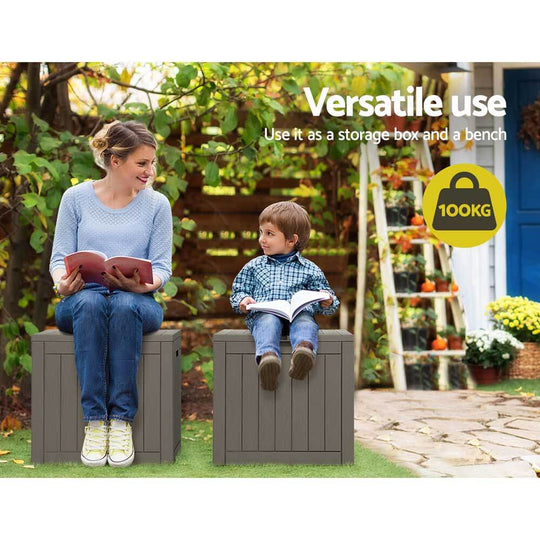 Gardeon outdoor storage box used as a bench by a woman and child, highlighting its versatile 100kg capacity and practical design.