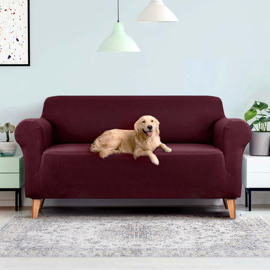 Artiss burgundy sofa cover on a couch with a golden retriever, showcasing affordable protection and style.