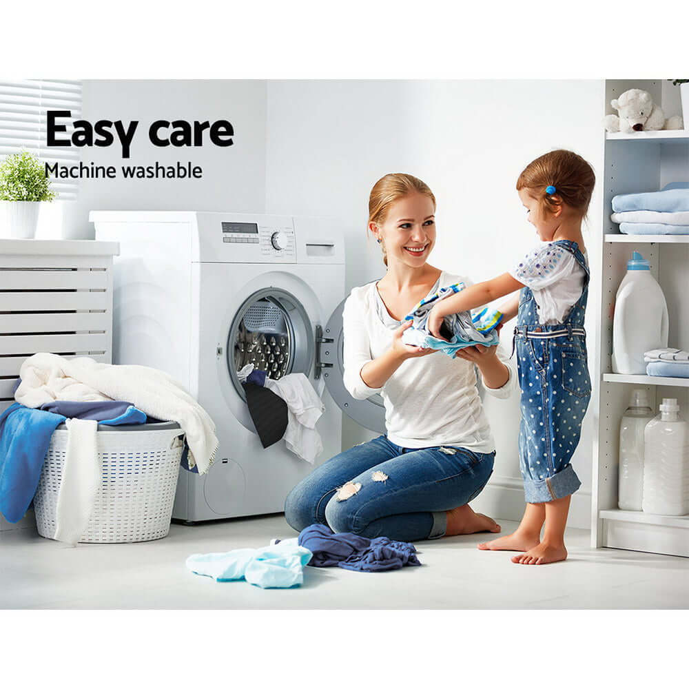 A woman and child in a laundry room, showcasing easy care with machine washable fabrics.