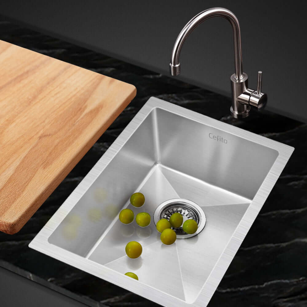 Cefito kitchen sink 44x34cm stainless steel nano basin single bowl silver with green olives and cutting board on black countertop