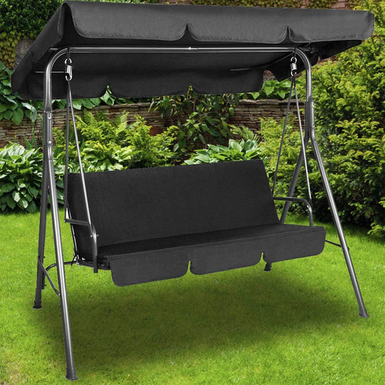 Milano black outdoor swing bench seat chair with canopy, three-seater garden hammock in a lush green setting.