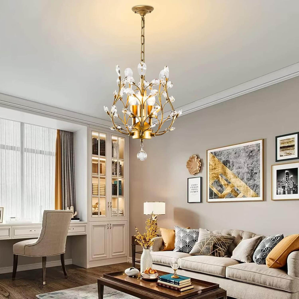 Crystal chandelier with vintage gold finish and 3 lights, enhancing a stylish living room decor.