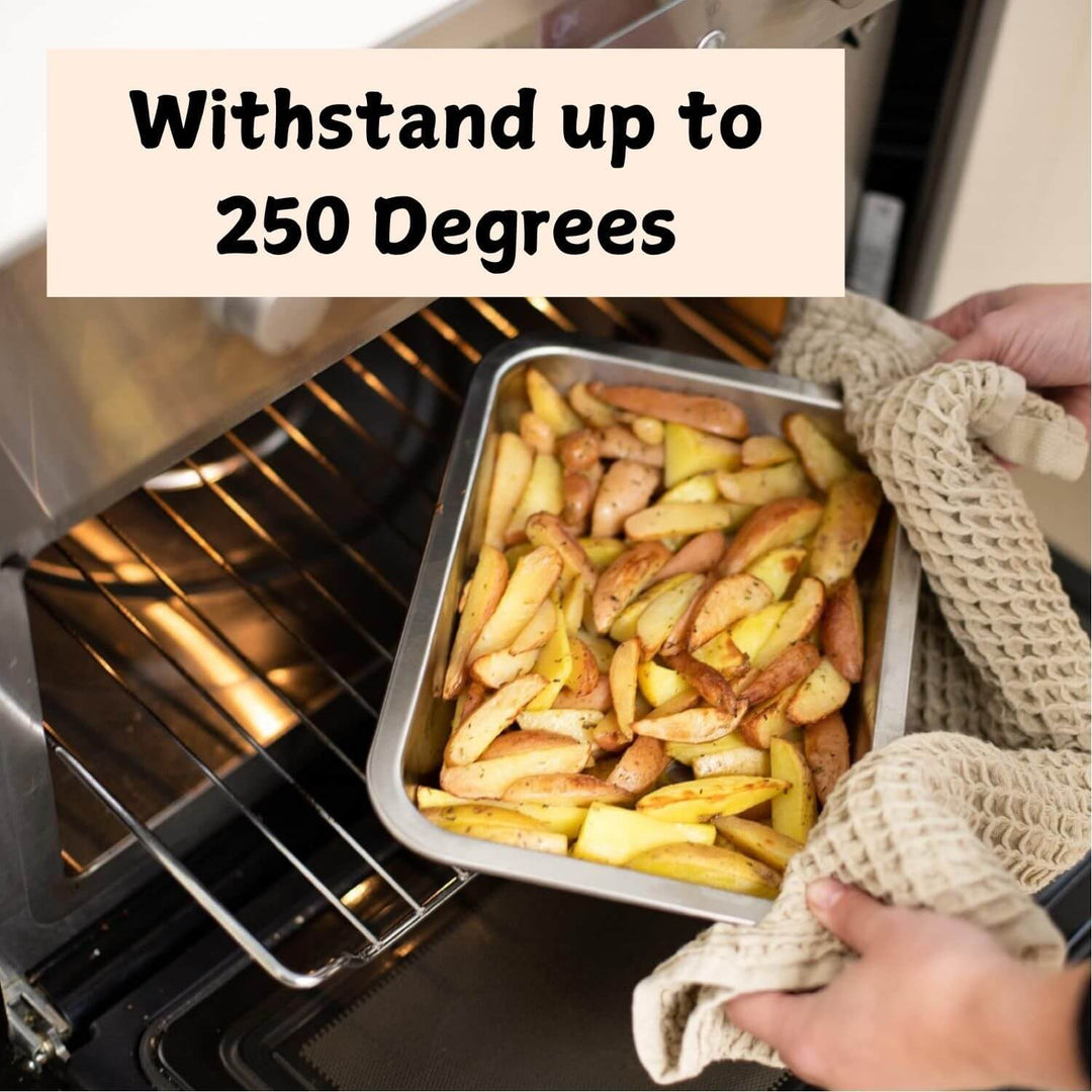 Oven-safe tray with roasted potatoes, withstands up to 250 degrees, perfect for cooking and baking.