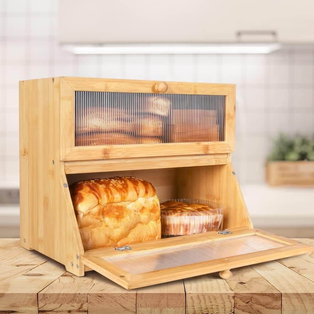 Double layer bamboo bread box with clear window, spacious for bread and baked goods on kitchen counter.