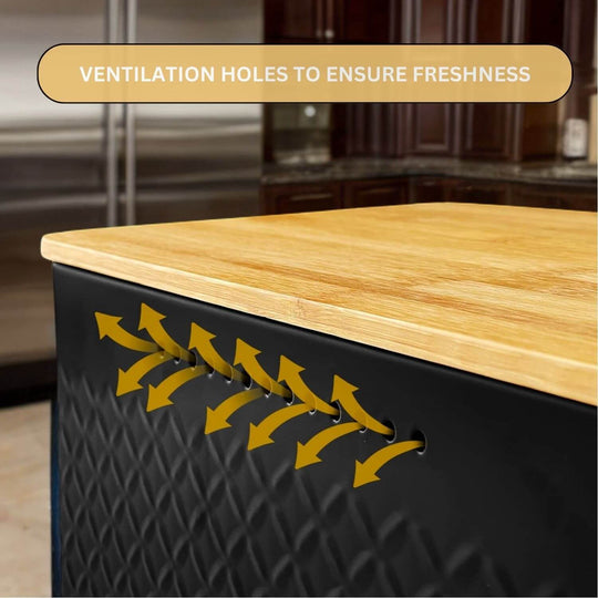 Ventilation holes in stylish bread bin ensure freshness, featuring a bamboo cutting board lid on a sleek black container.