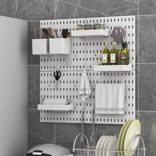 Modern pegboard wall organizer with kitchen utensils, shelves, and hanging accessories for efficient space-saving.