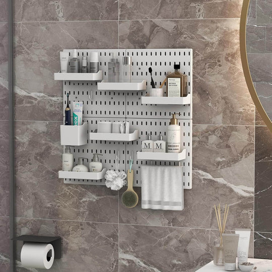 White pegboard wall organizer displaying beauty products and accessories in a modern bathroom setting.