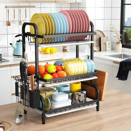 Dish drying rack with colorful plates, bowls, and fruit, showcasing 3-tier design for kitchen storage and organization.