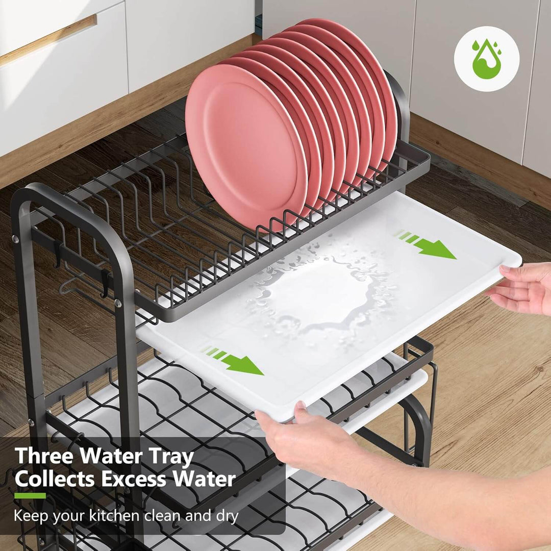 Dish drying rack with pink plates and three water trays for excess water collection, keeping the kitchen clean and dry.