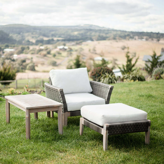 Paradise 3-piece furniture set for outdoor relaxation, featuring a sofa armchair, footrest ottoman, and coffee table.