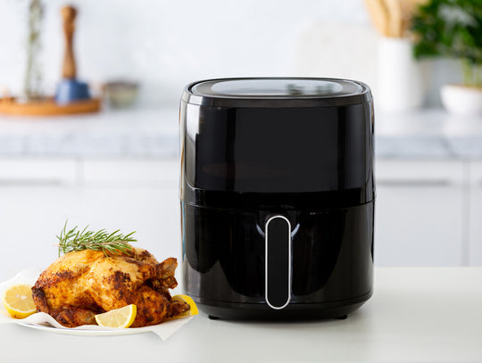 6L Digital Air Fryer with Glass Window on Kitchen Counter Next to Roasted Chicken and Lemon Slices