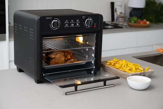 Black 23L Air Fryer Oven with Roasted Chicken and Fries in Modern Kitchen - Value Furniture, Quality, and Affordable Cooking Solution