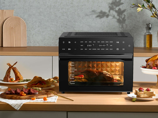 Multi-function air fryer oven cooking a meal in a modern kitchen with value furniture and quality appliances.