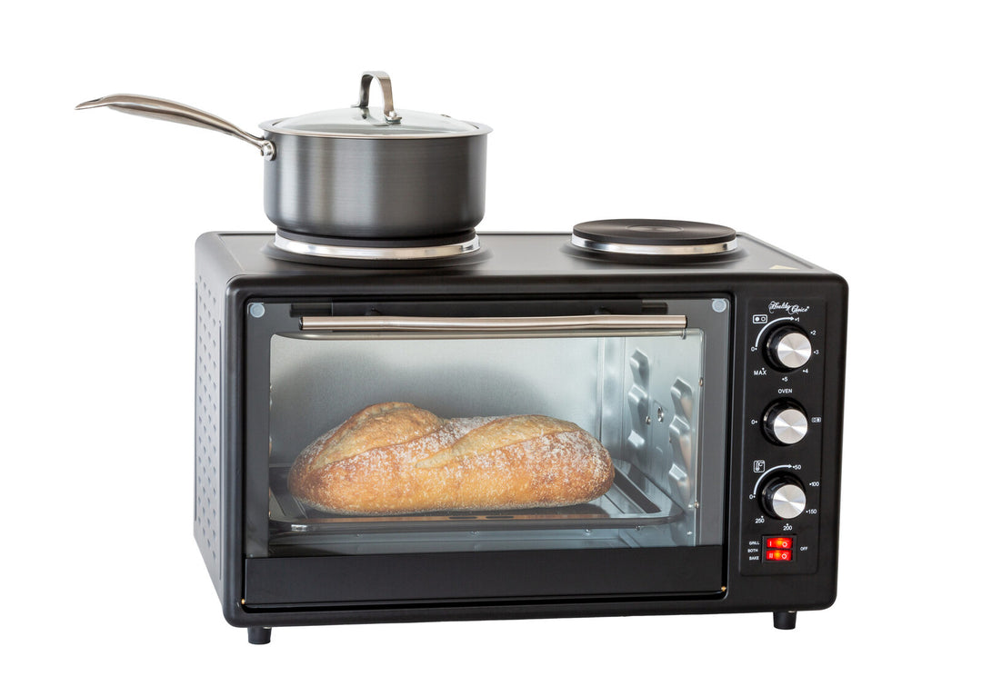 Portable oven with rotisserie cooking, 34L capacity, baking bread, and a saucepan on top. Affordable quality value furniture.