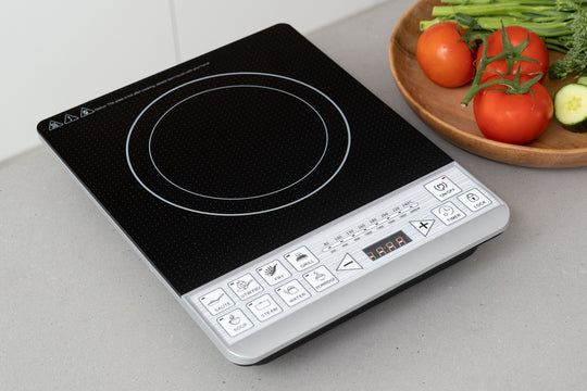 Digital induction cooker single electric stove top for cooking with vegetables nearby, showcasing value furniture, affordability, and quality.