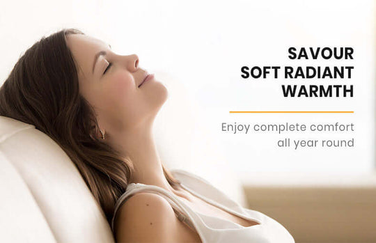 Woman enjoying soft radiant warmth with a serene expression, promoting year-round comfort.