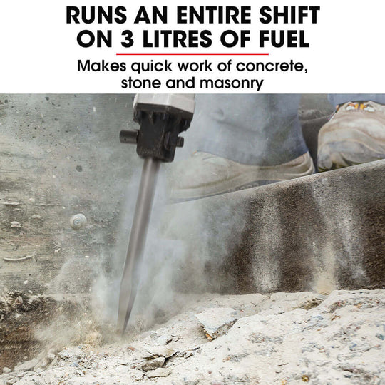 Baumr-AG jackhammer with 52cc engine breaking through concrete, efficient fuel use for heavy-duty DIY work.