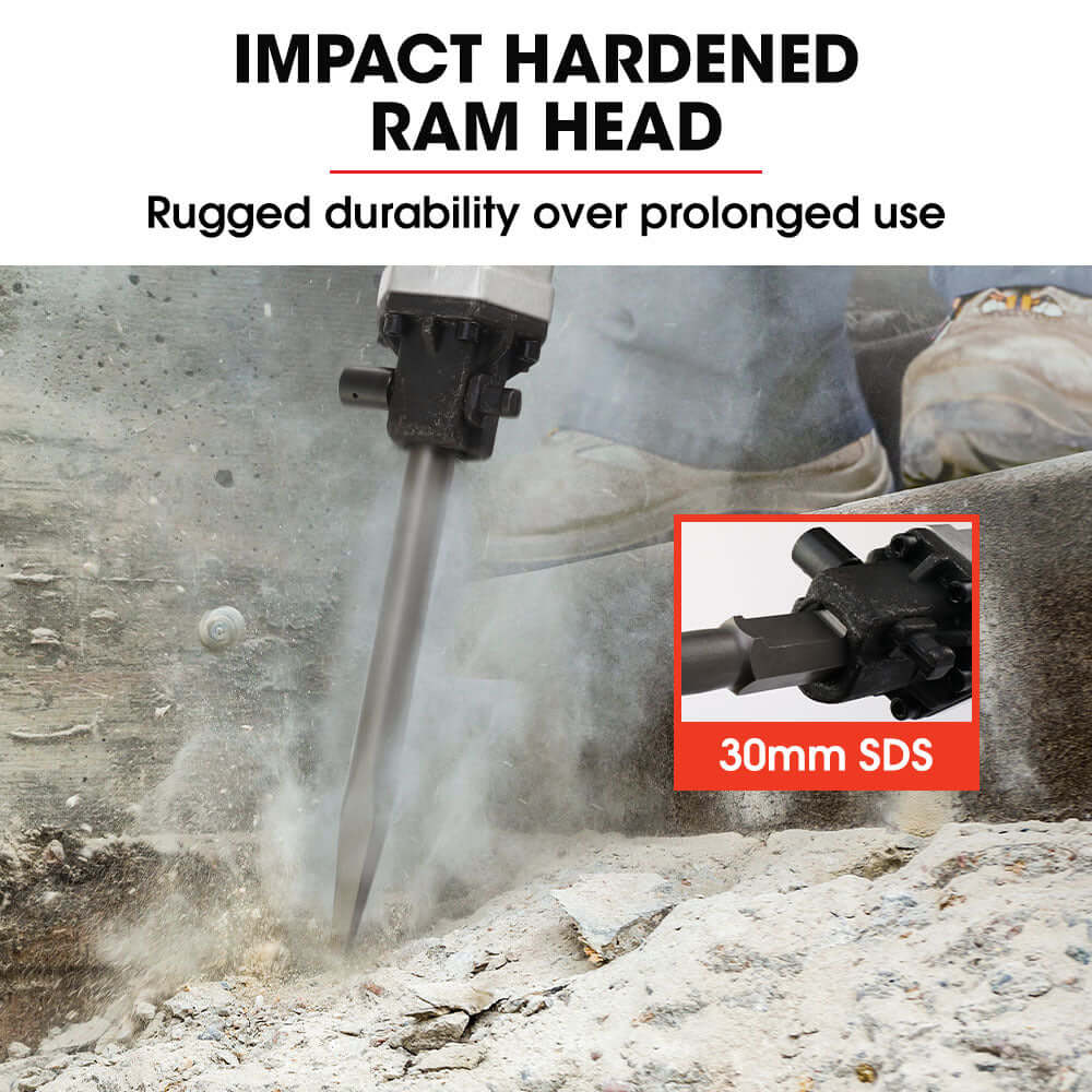 Impact hardened ram head of Baumr-AG jackhammer showcasing rugged durability during operation.