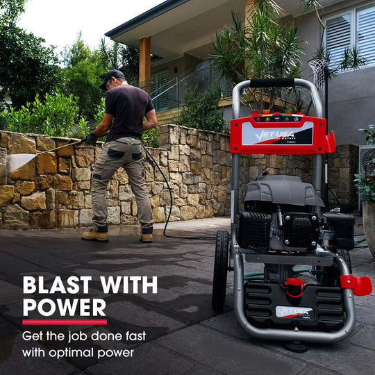 Man using Jet-USA 4800PSI petrol pressure washer for efficient outdoor cleaning, showcasing power and quality.