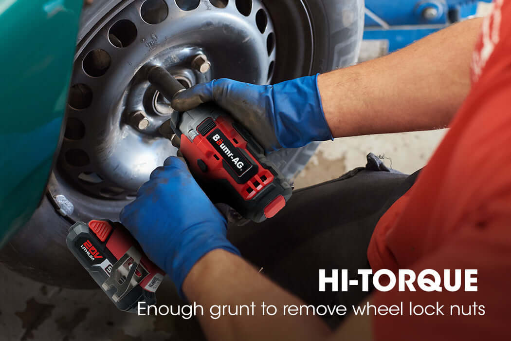 Person using BAUMR-AG 20V Cordless Impact Driver to remove wheel lock nuts, showcasing affordable DIY quality tools.