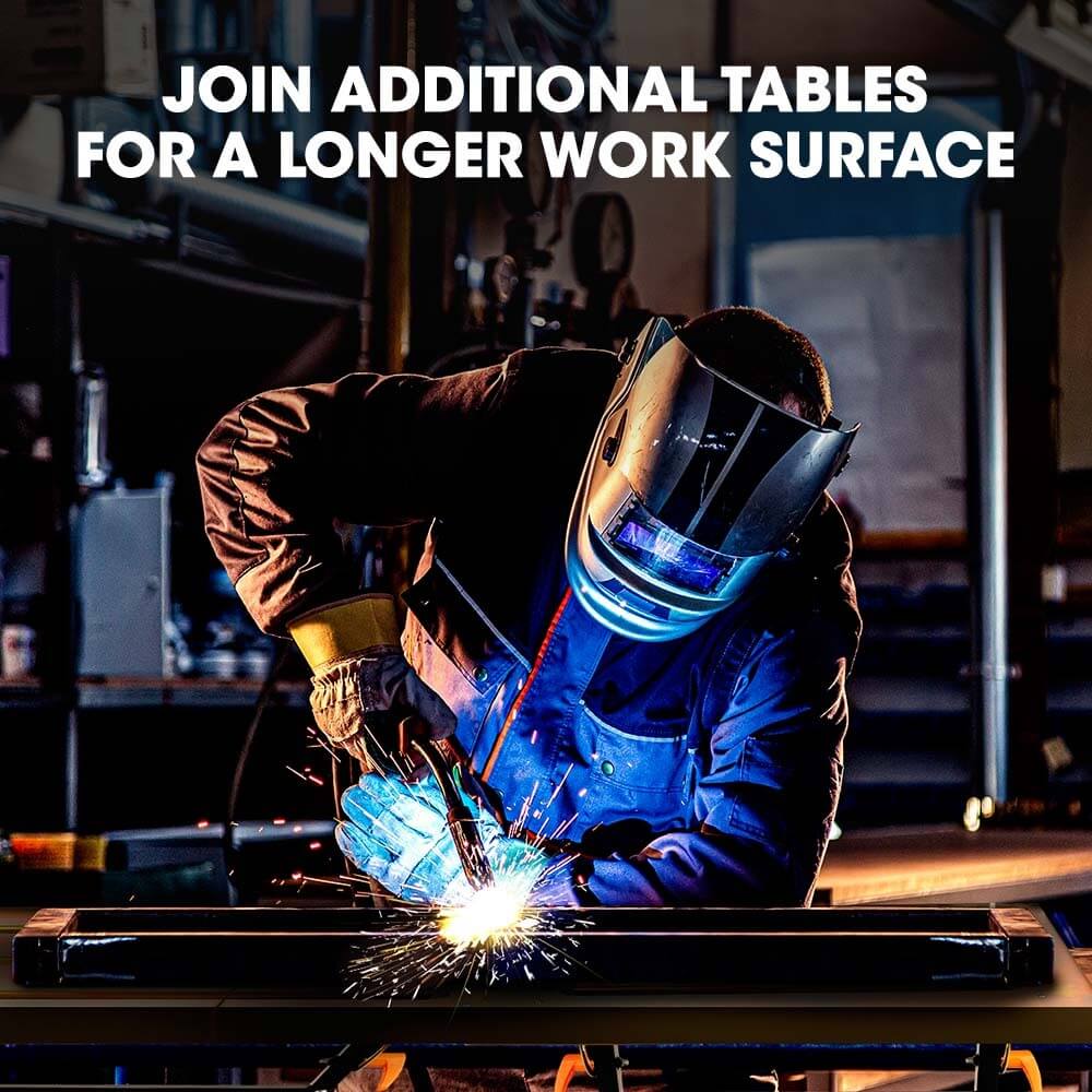 Welder using ROSSI welding table, demonstrating adjustable length by joining additional tables.