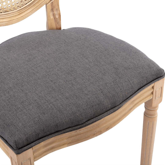 Close-up of AADEN dining chair seat cushion in grey fabric, showcasing quality and chic French design details.