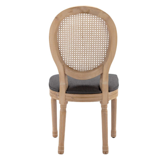 Grey upholstered dining chair with solid wood legs, showcasing a chic French design and intricate rattan back.