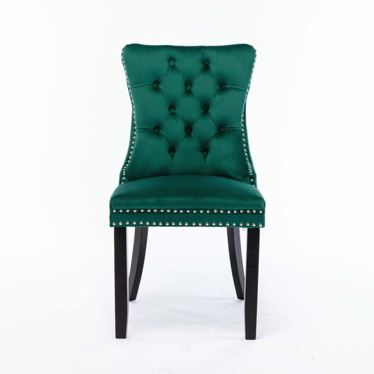 Elegant green velvet dining chair with tufted back and stud trim, featuring solid wood legs for quality support.