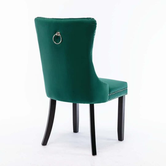 Affordable green velvet dining chair with solid wood legs and unique ring accent on the back for a chic modern look.