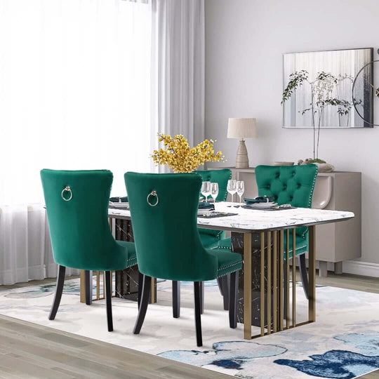 Elegant green velvet dining chairs with modern design around a stylish dining table in a bright, contemporary setting.