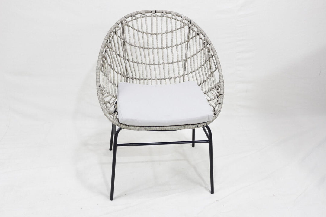 Stylish PE wicker chair with a comfortable cushion, ideal for outdoor dining and relaxation.