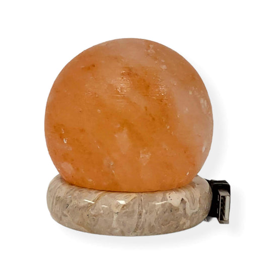 Affordable USB Himalayan salt lamp in a carved ball shape, enhancing decor with a soothing glow and quality design.